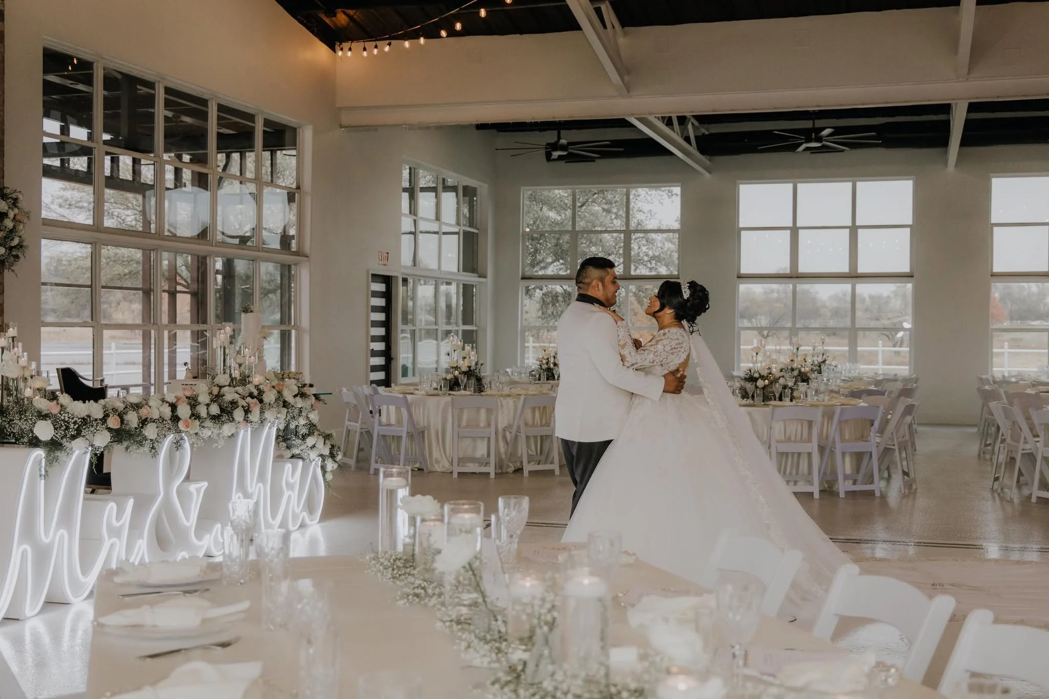 Table setting inside the window-wrapped hall